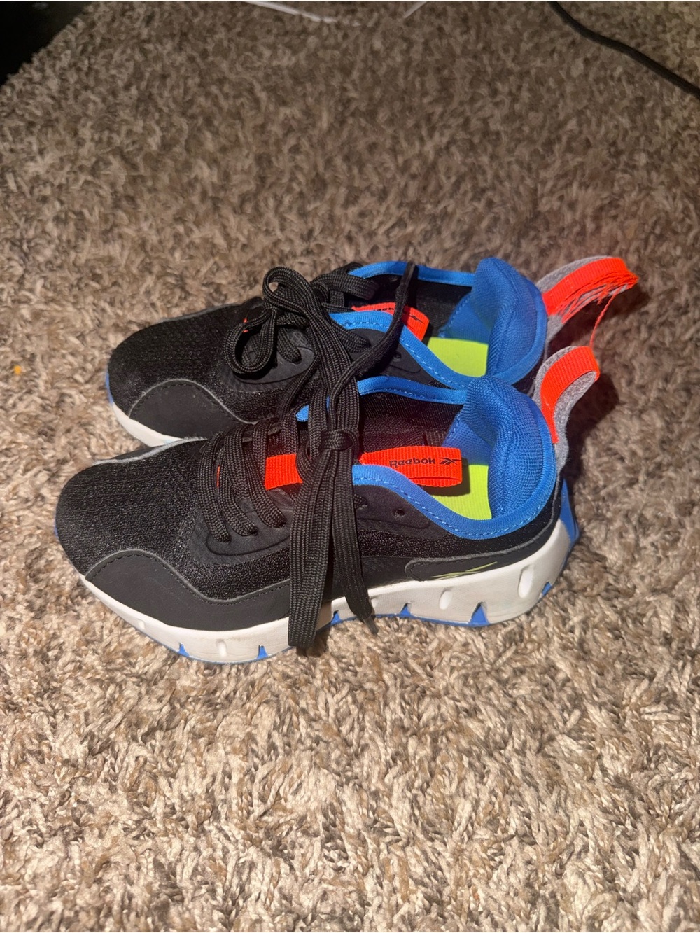 Reebok Kids Black Sneakers with Blue Lining and Bright Orange Heel Tabs